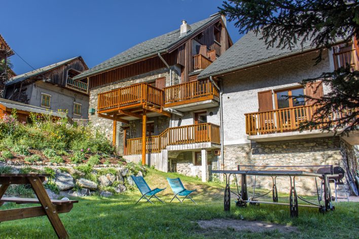 Alpine chalet in the summer garden