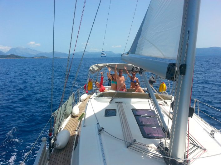 Family enjoying a skippered yacht charter in Greece