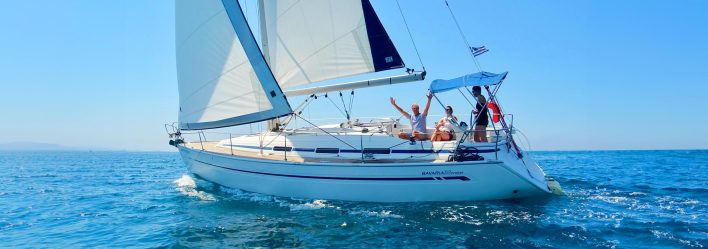 Happy people sailing a yacht