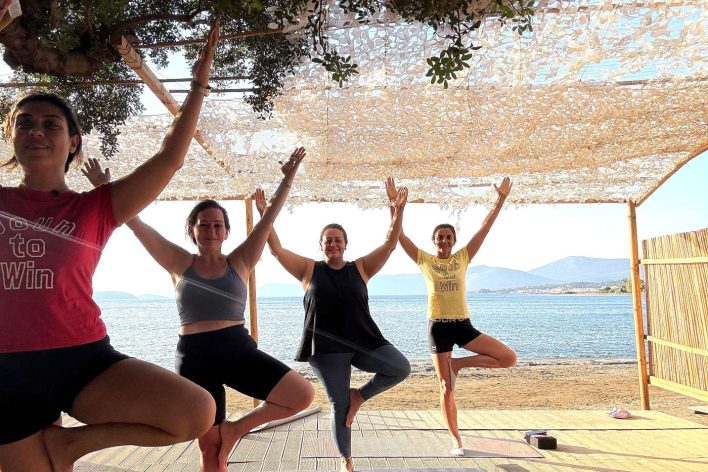 Beach Yoga Session in Evia, Greece at Stira Bay Beach Club