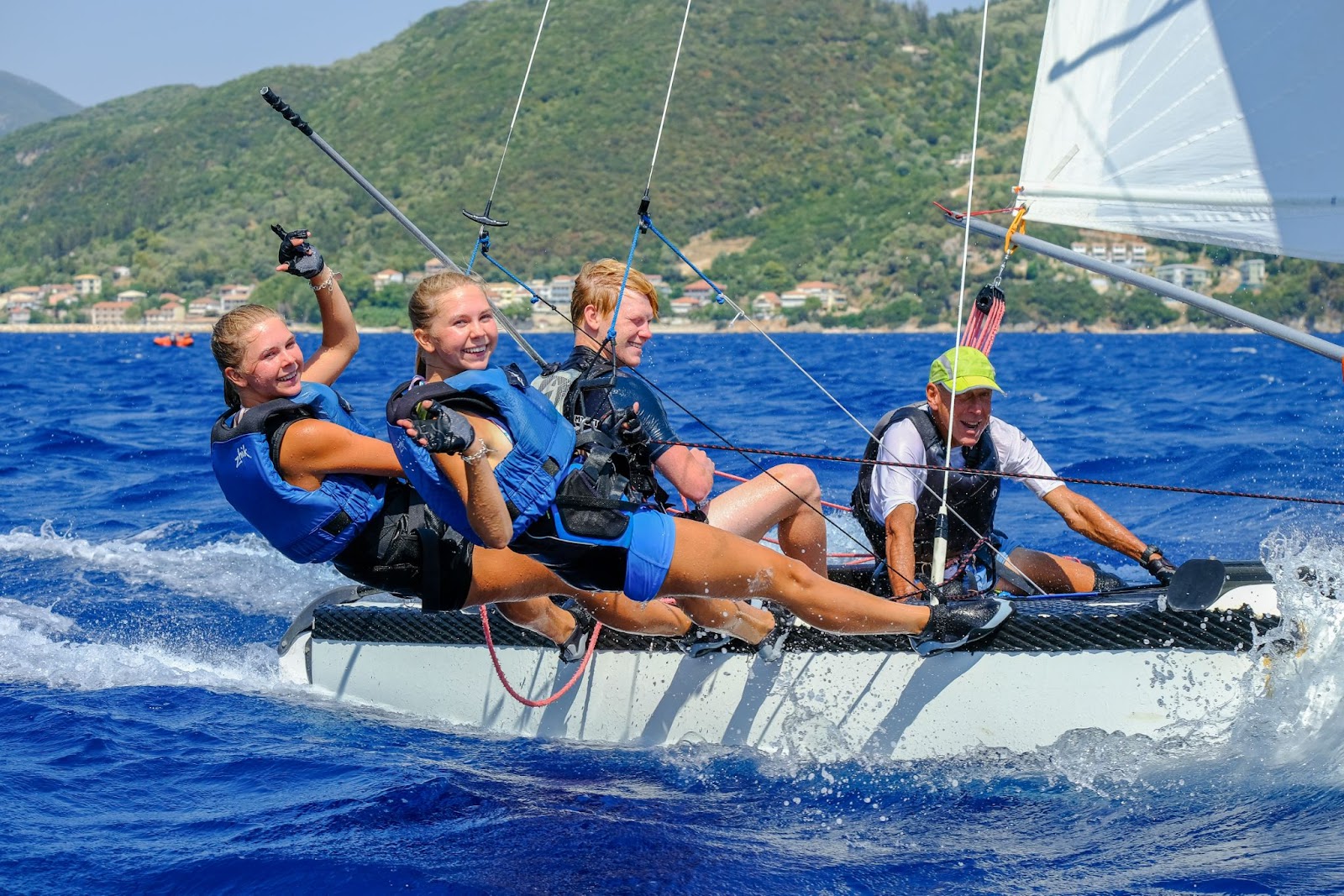 Sailing instructor taking out students in harnesses on a cat in Greece&nbsp;