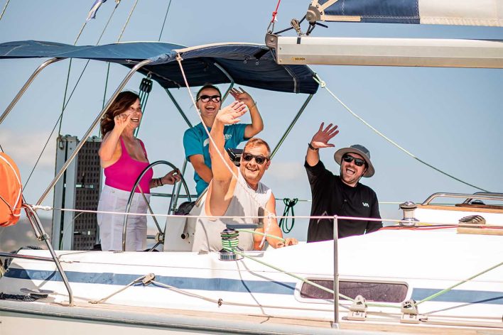 Group of friends enjoying yacht sailing with a skipper in Kefalonia
