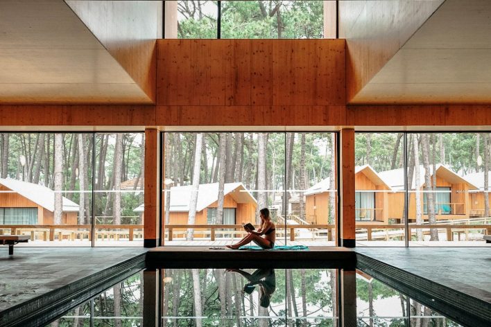 A lady relaxes at a pool and spa