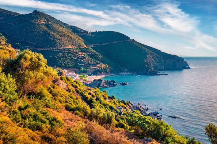 View towards a hillside overlooking a blue sea